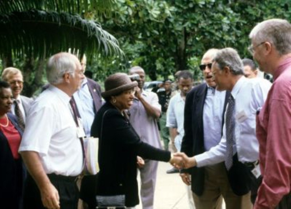 Visitors receive handshake from IITA staff during a visit to IITA Ibadan