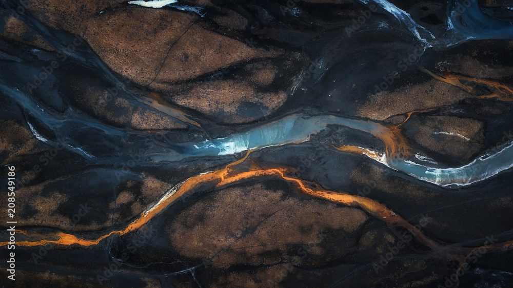 Aerial photo of mix color of stream in to river