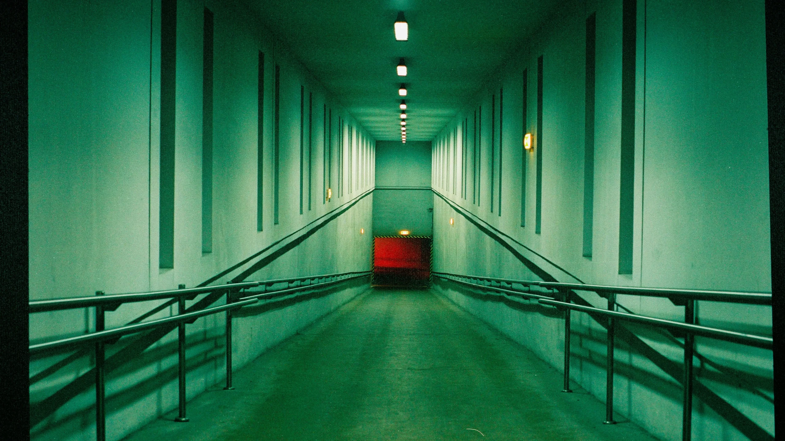 Empty Ramp with Metal Railings in a Building